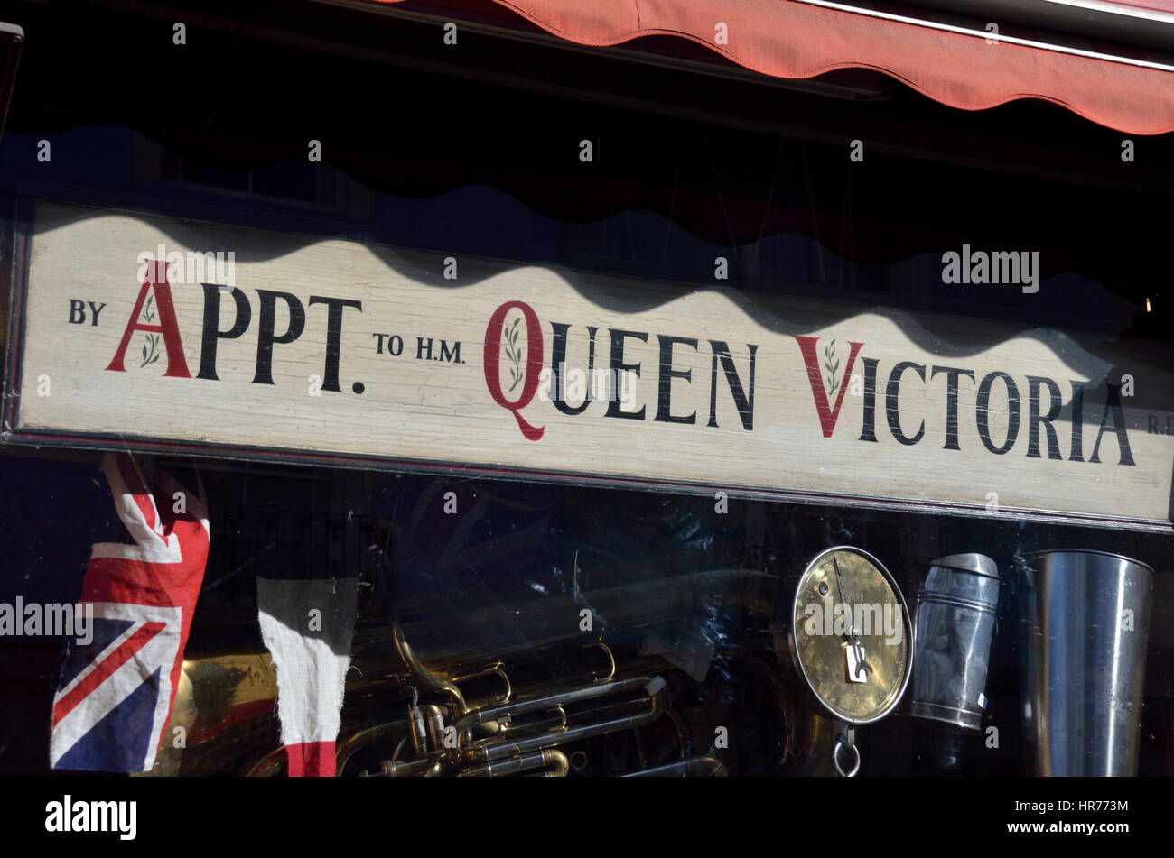 By Appointment to Her Majesty Queen Victoria sign in a shop window Stock Photo
