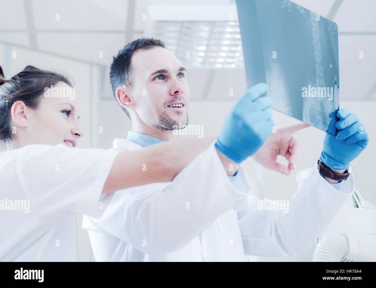 X Ray Imaging Consulting by Medical Staff in the Hospital Room