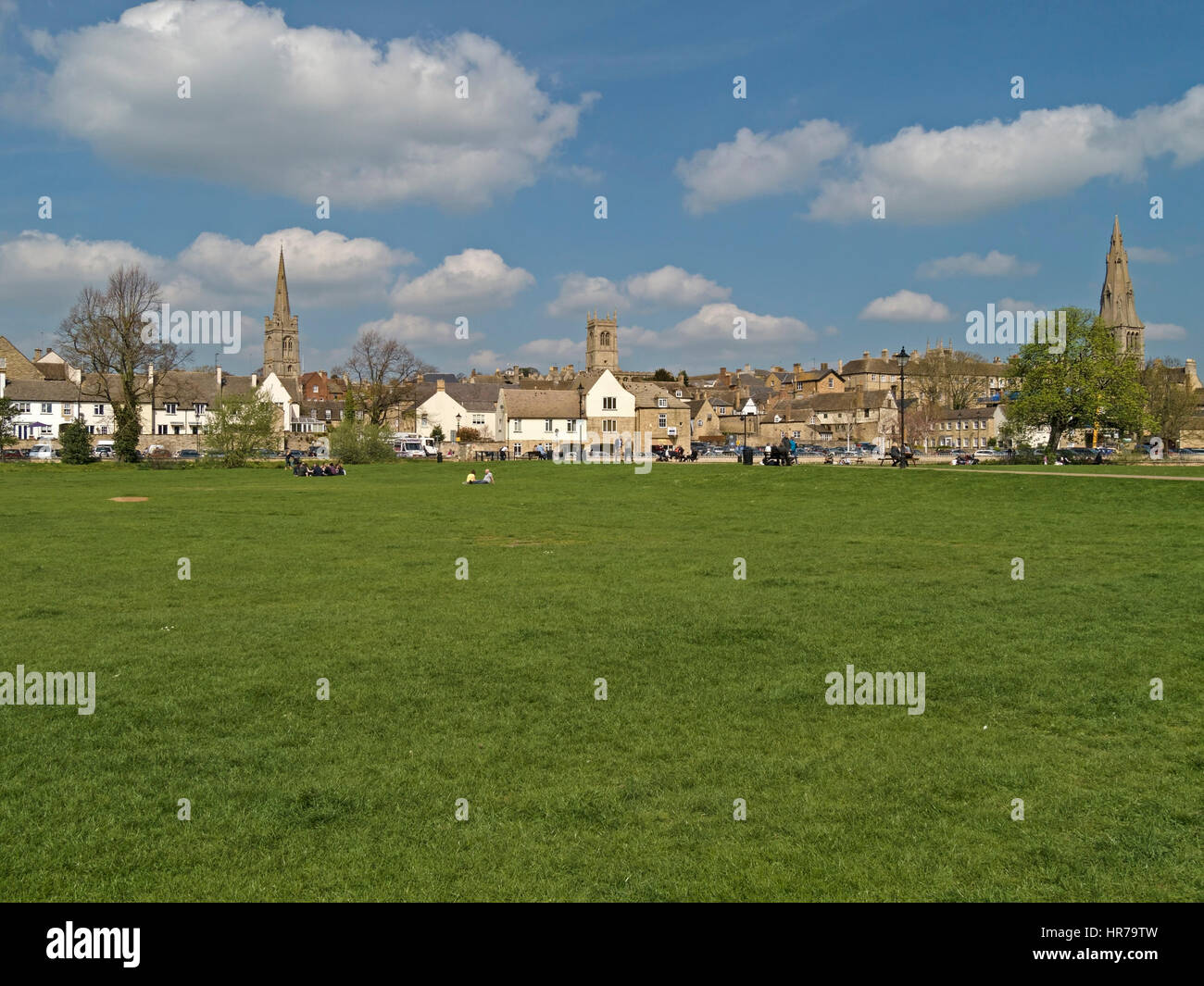 Stamford skyline with green water meadows in foreground and blue sky above, Lincolnshire, England, UK Stock Photo