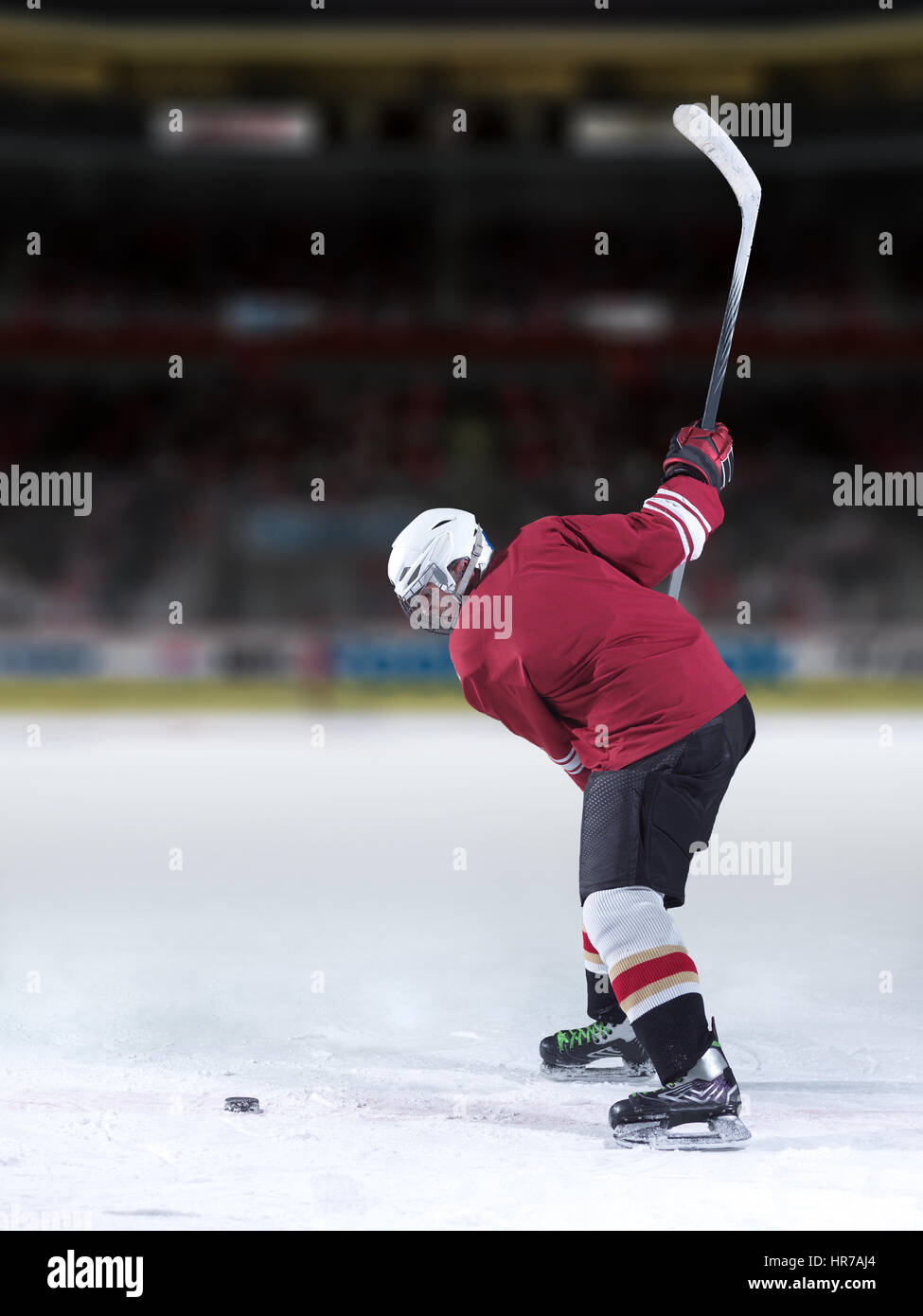 ice hockey player in action kicking with stick Stock Photo Alamy