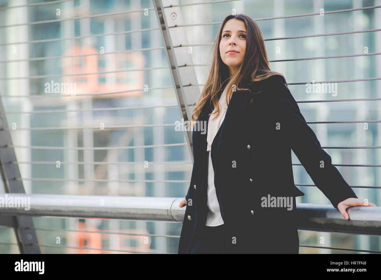 young authentic business woman in urban setting Stock Photo