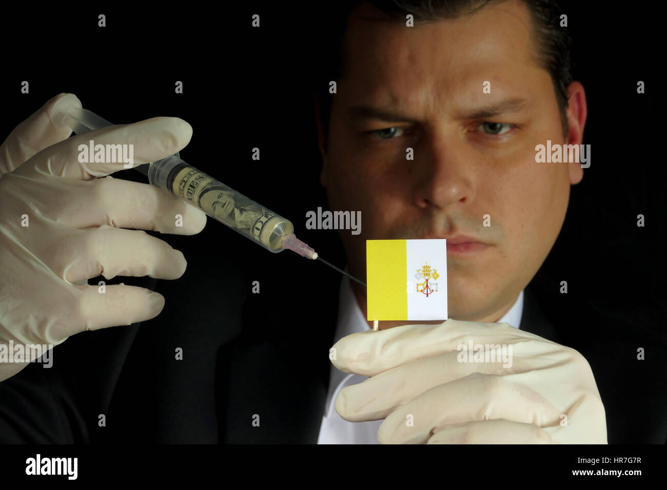 Fiscal Injection Young businessman gives a financial injection to Vatican City flag ...