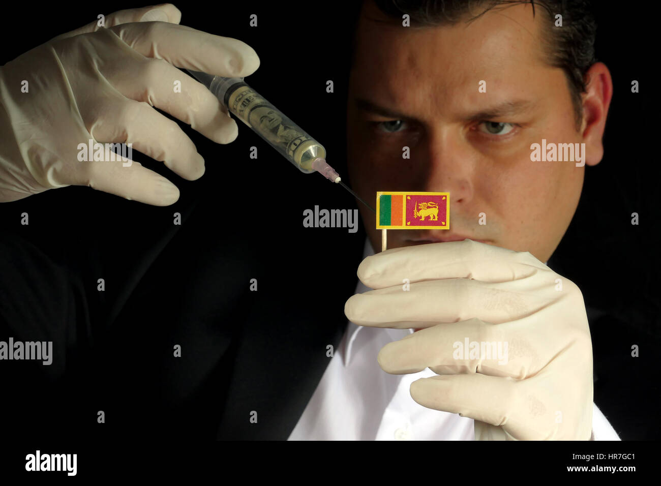 Fiscal Injection Young businessman gives a financial injection to Sri Lankan flag ...
