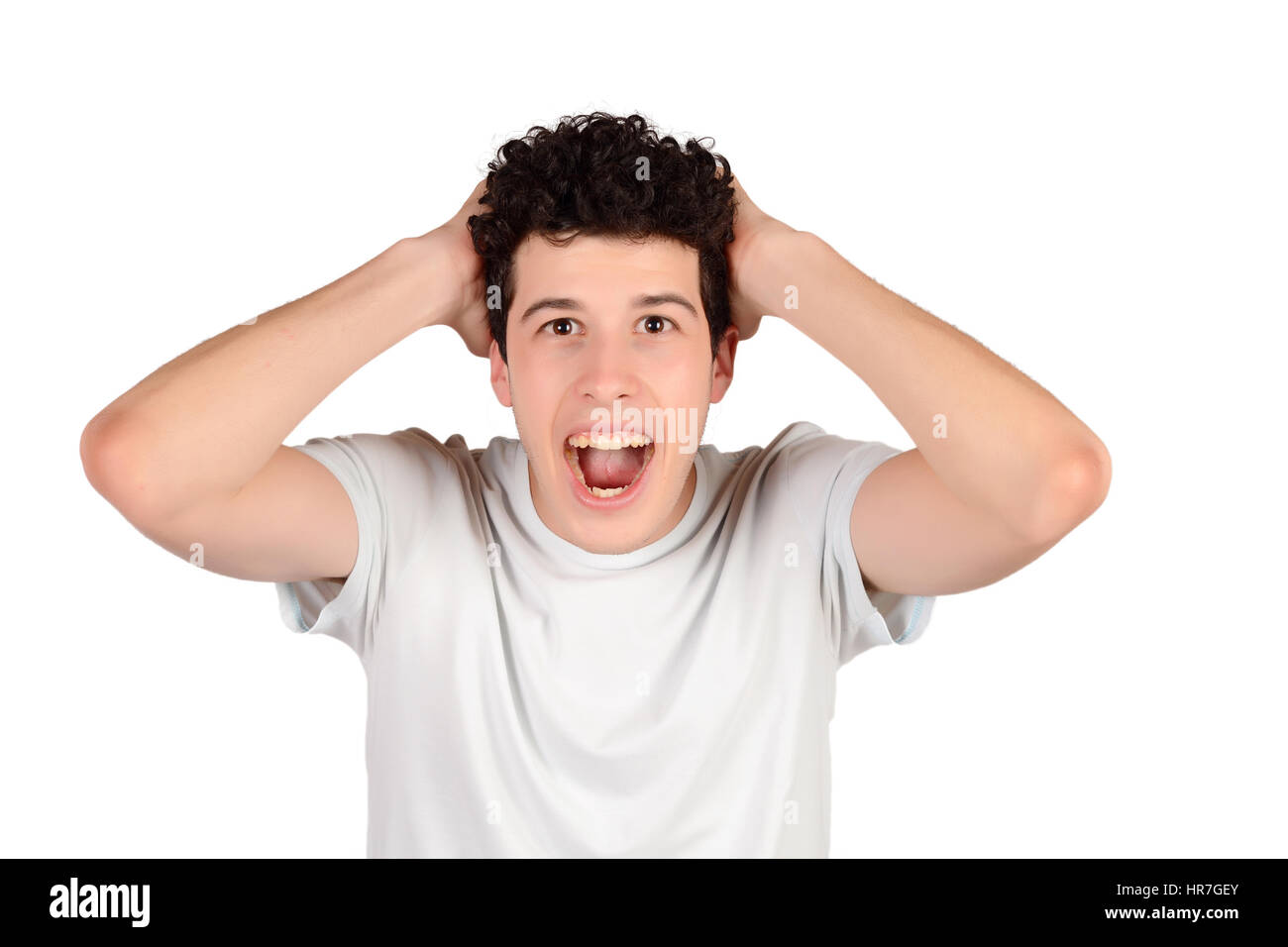 Portrait of a young amazed man. Isolated white background Stock Photo ...