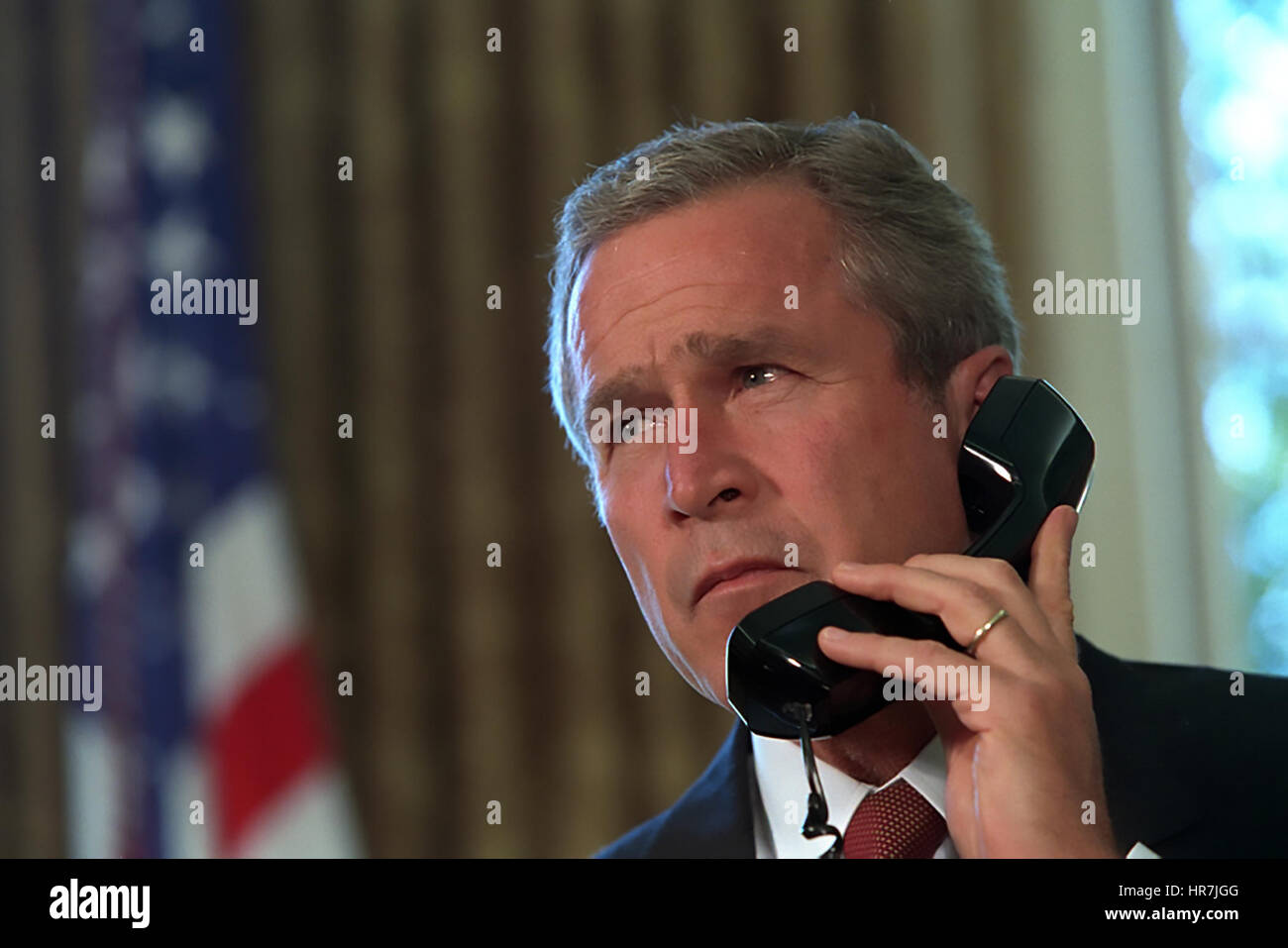 PRESIDENT GEORGE W. BUSH in a phone call from the Oval Office in 2011.  Photo: Eric Draper/White House official Stock Photo