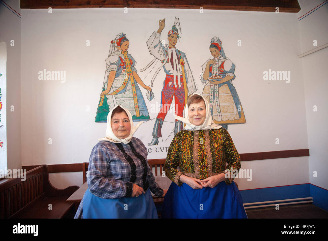 Portrait of Moravian women in front of a mural Stock Photo