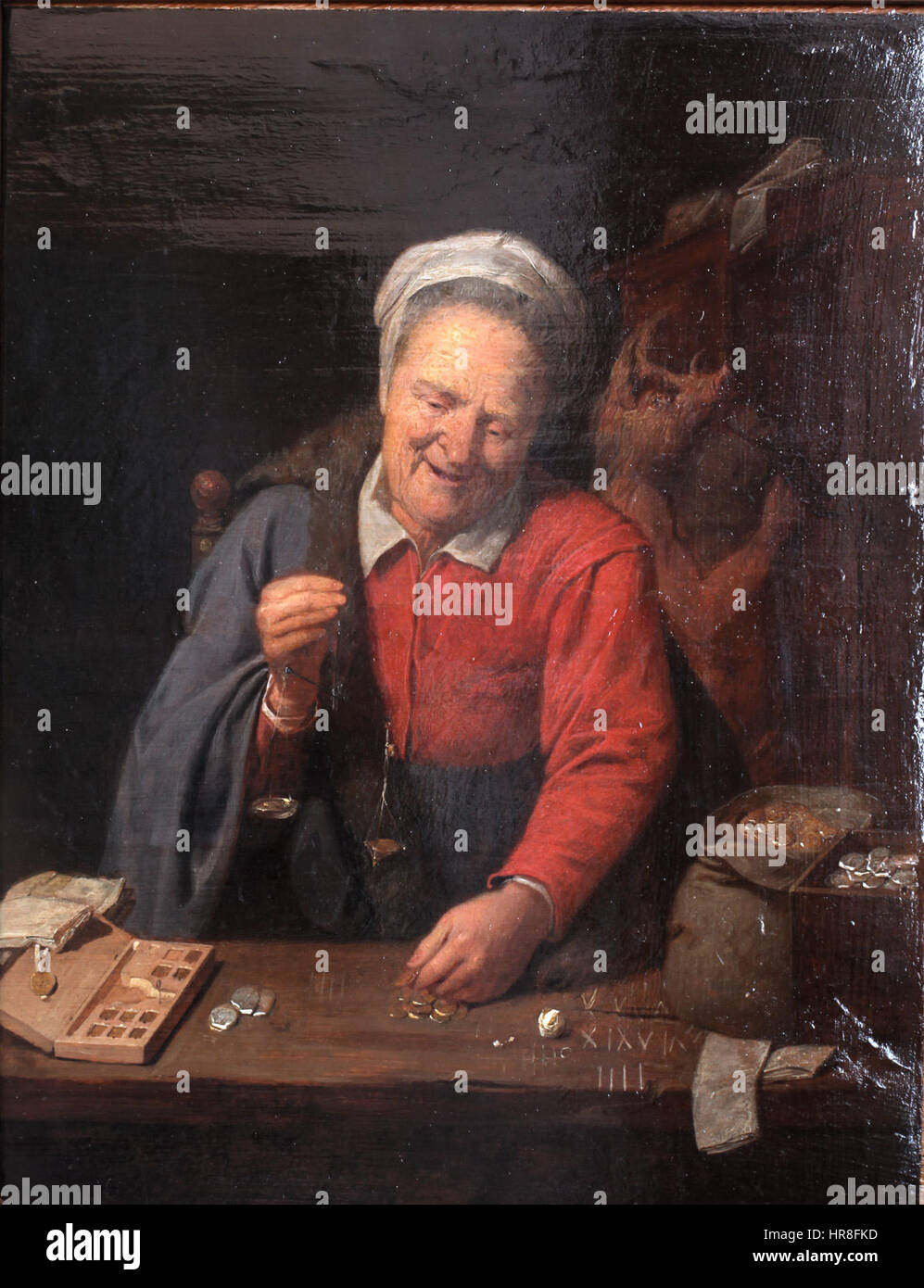 Woman weighting gold-David Ryckaert-MBA Lyon A2854-IMG 0403 Stock Photo