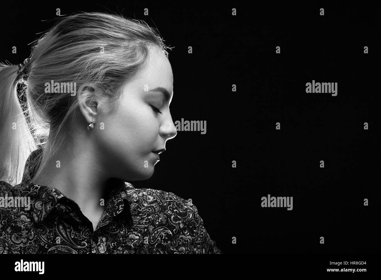 sad woman profile on black background, monochrome Stock Photo - Alamy