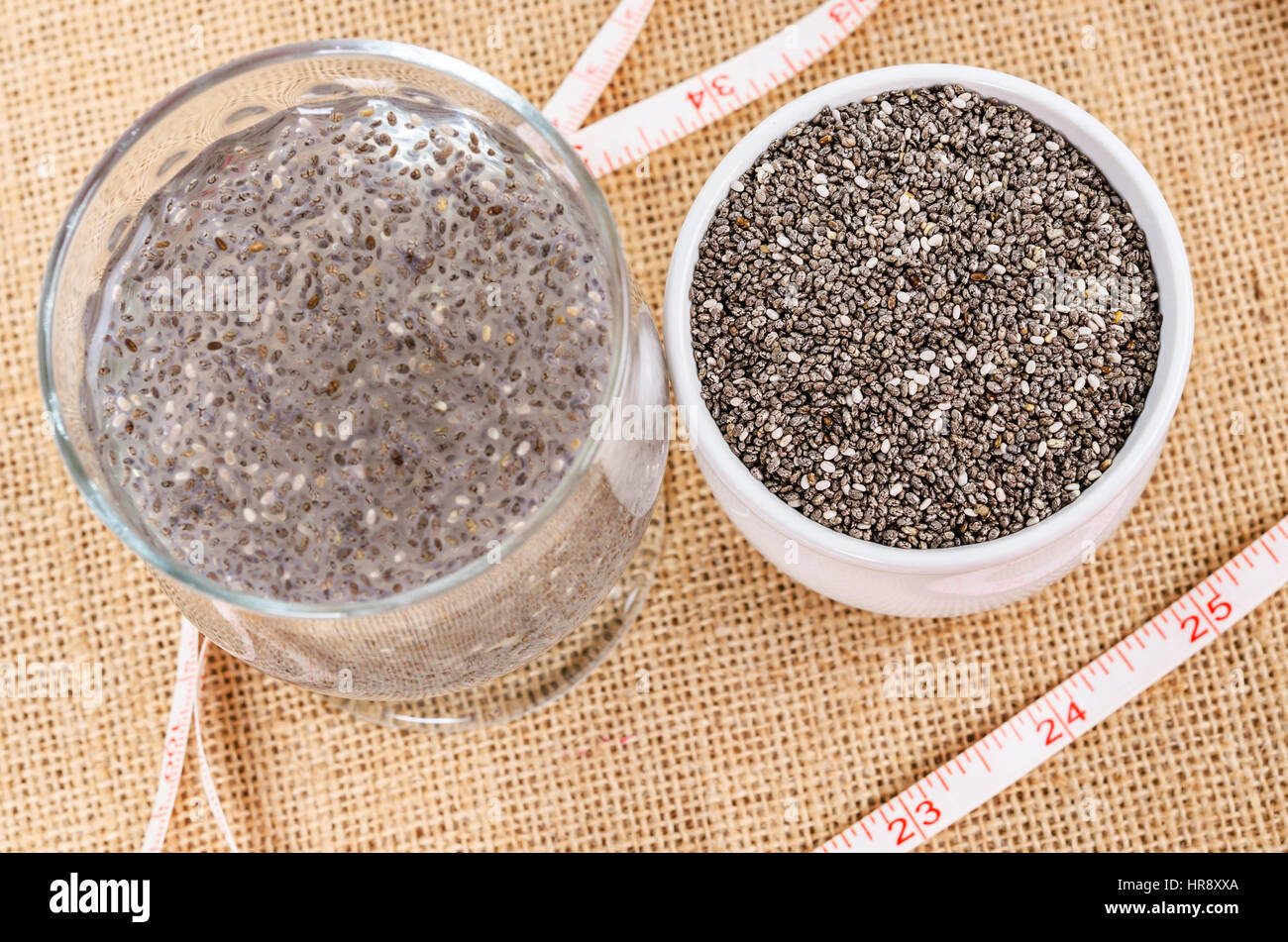 Healthy Chia seeds in white cup and soak in water with measuring tape on  sack background, Healthy food concept Stock Photo - Alamy