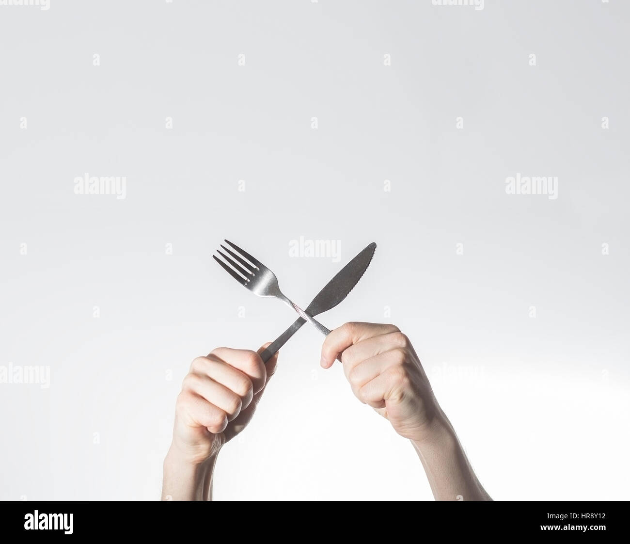 breakfast concept, hands hold knife and fork crosed,  Space for text, free space, Stock Photo