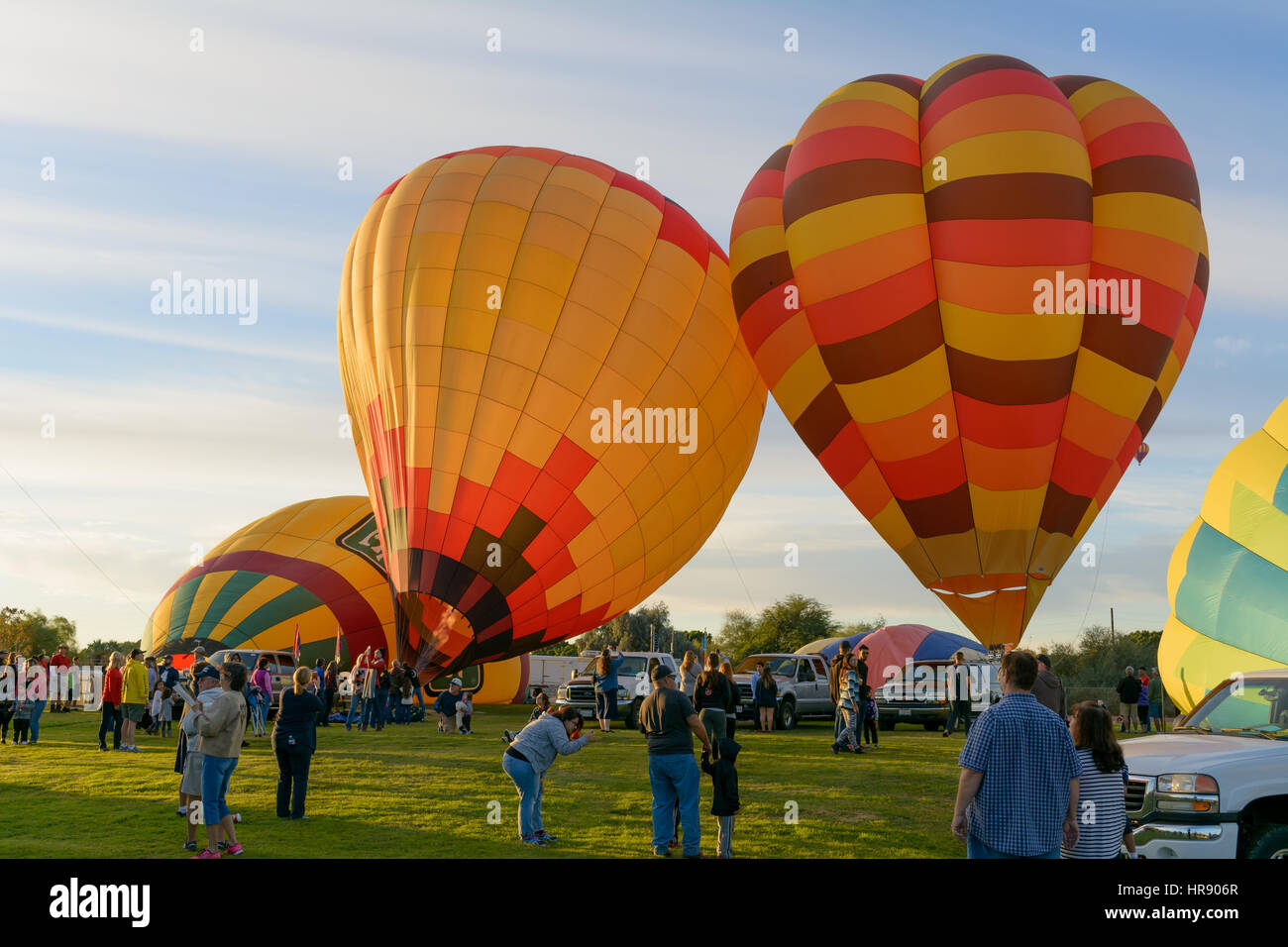 Multiple hot air balloons preparing to launch from the Yuma West Wetlands Park in Yuma, AZ during the Colorado River Crossing Balloon Festival Stock Photo
