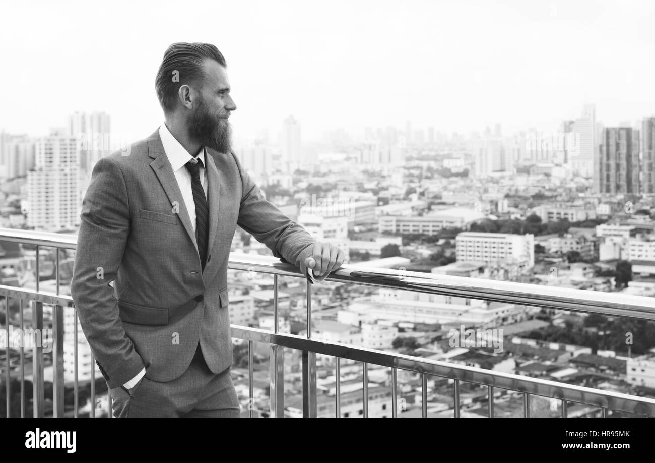 Business Man Glancing City View Stock Photo
