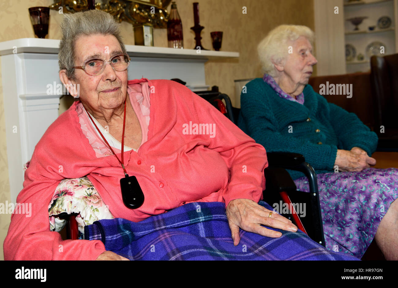 Two elderly women relaxing in a care home, Alton, Hampshire, UK. 26 February 2017. Stock Photo