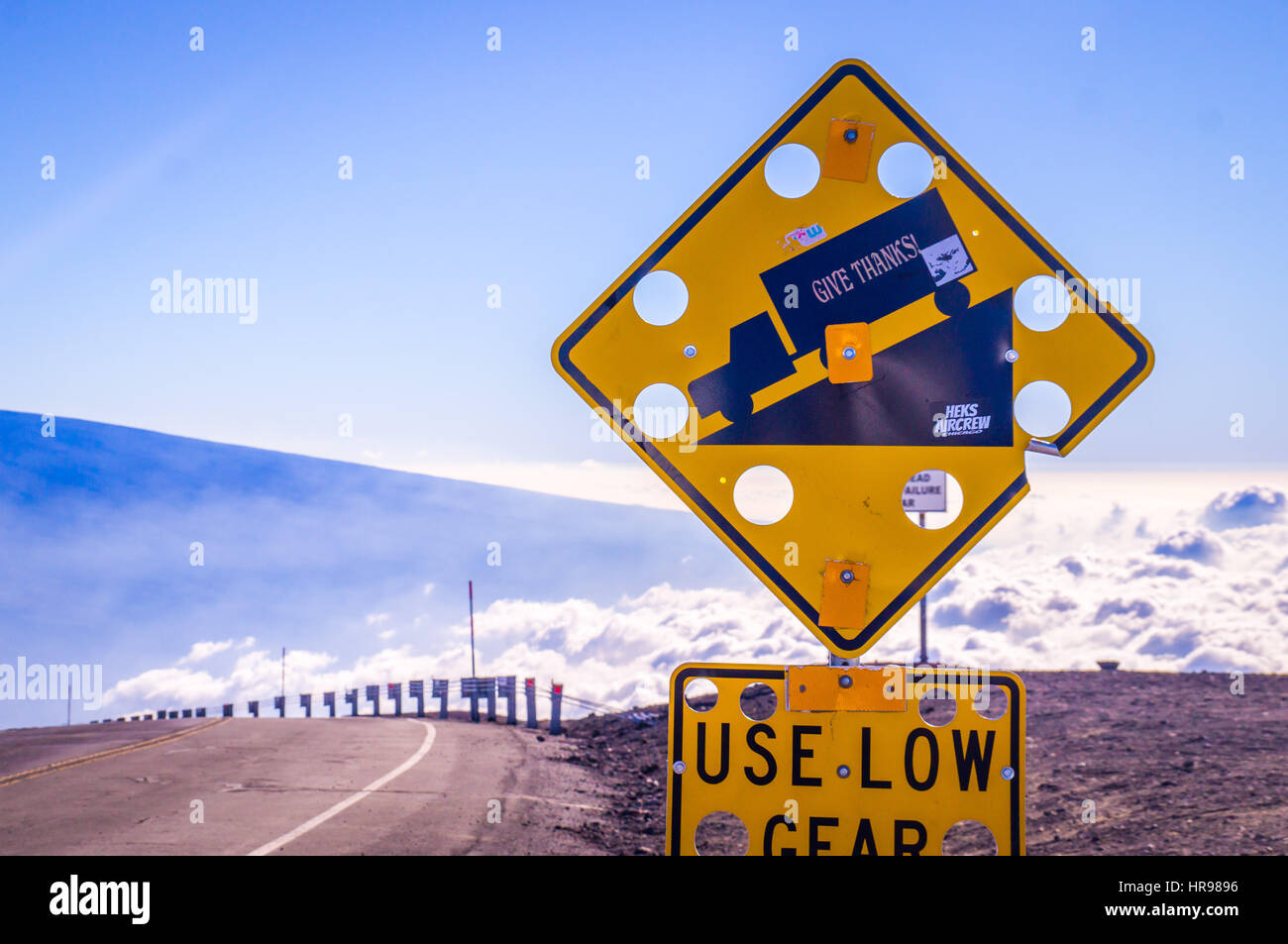 Sign on Mauna Kea, Big Island Hawaii, US. On the world's highest mountain base to top 10.200m Mauna Kea the wind is so strong that street signs need t Stock Photo