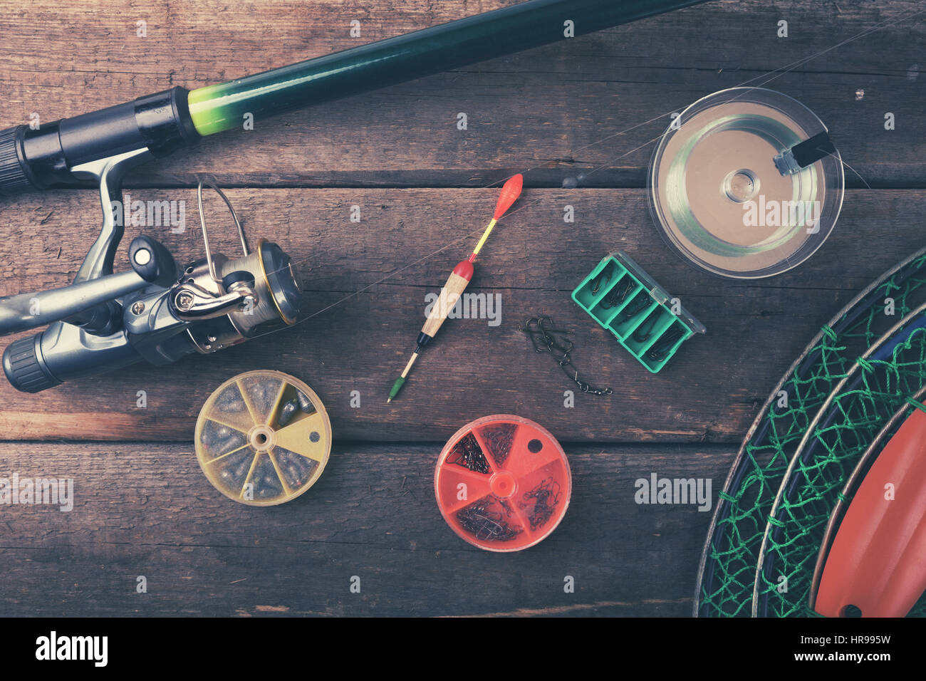 fishing equipment on old wooden table. top view Stock Photo