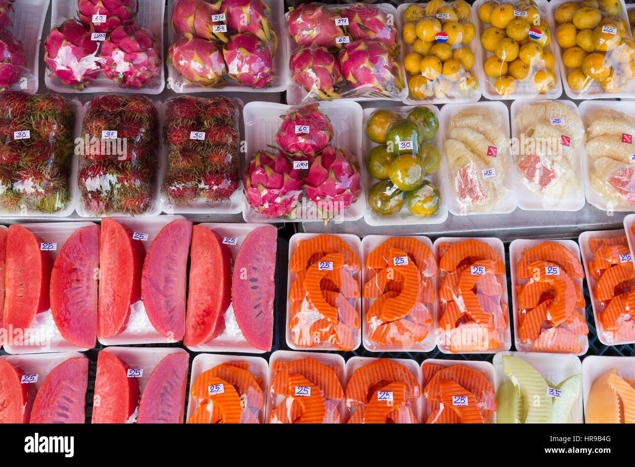 Tropical fruit for sale at Warorot Market (AKA Kad Luang), in Chiang Mai, Thailand. Stock Photo