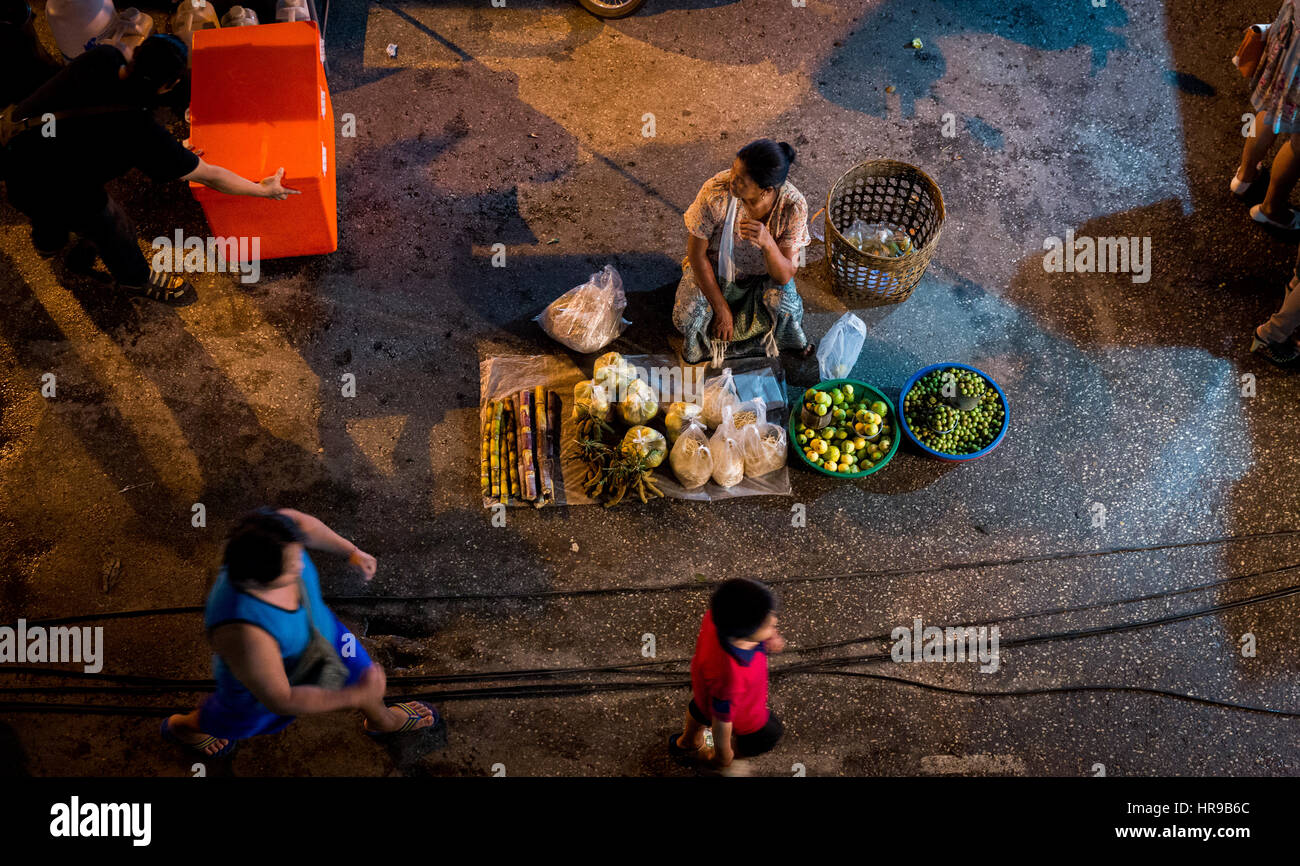 Aerial view of woman selling produce at Warorot Market (AKA Kad Luang), in Chiang Mai, Thailand. Stock Photo