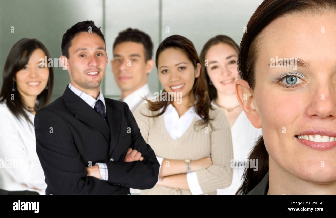 beautiful business woman and her team in an office Stock Photo - Alamy