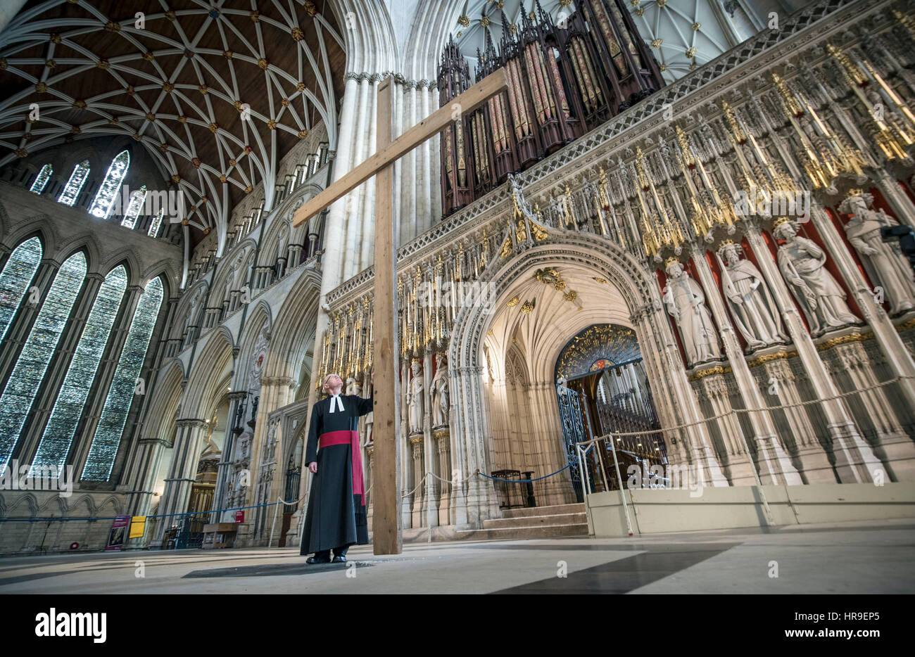 PABEST The reverend Canon Dr Christopher Collingwood with a large wooden cross, the central symbol of the Christian Faith, before it is hung in York Minster to symbolize the start of Lent on Ash Wednesday. Stock Photo