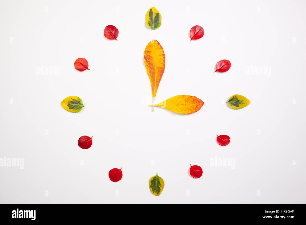 Autumn Time - Clock of autumn leafs Stock Photo