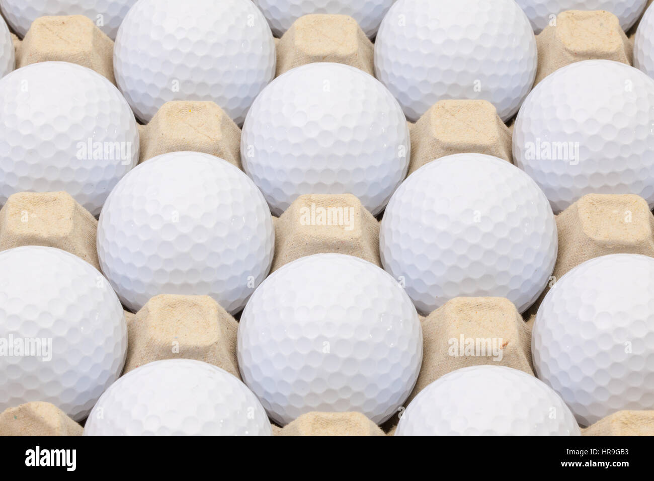 White golf balls in the box for eggs Stock Photo Alamy