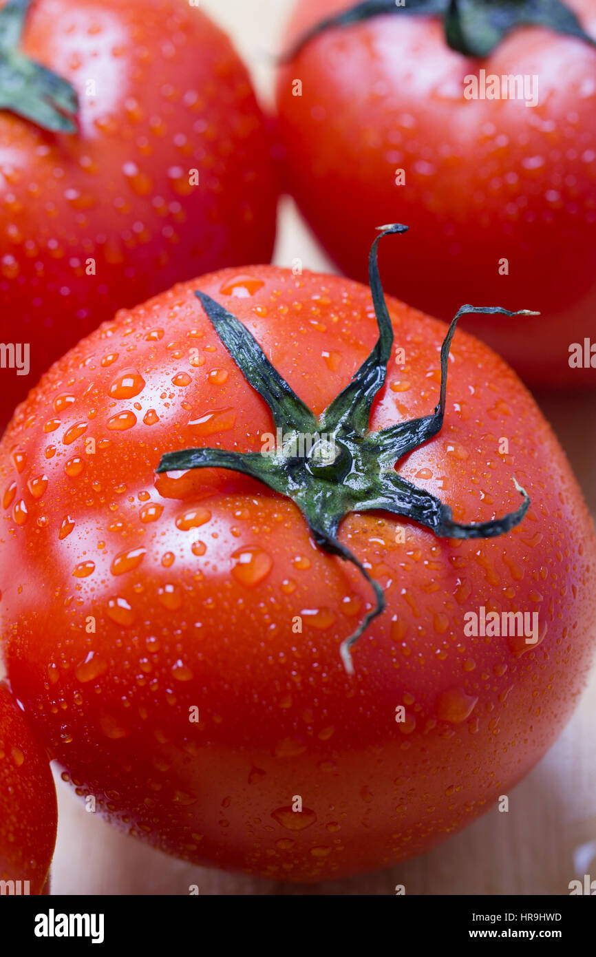 Fresh red tomatoes with water drops Stock Photo - Alamy