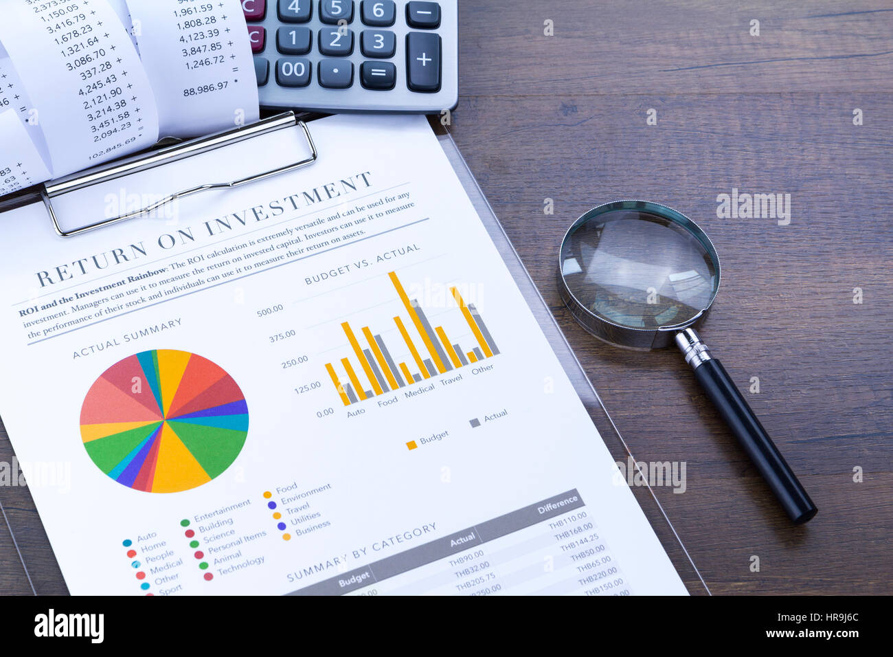 Return on investment analysis document with rainbow pie chart graph Stock Photo