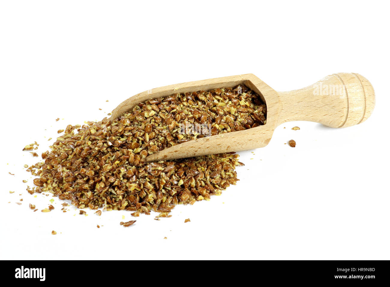 wooden scoop with flaxseed grist isolated on white background Stock Photo