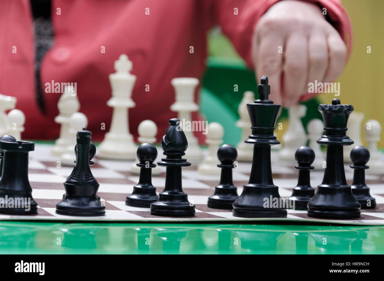 Woman and chess pieces Stock Photo