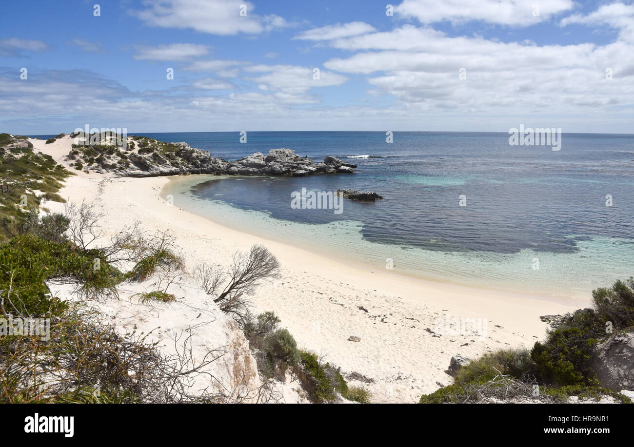 Idyllic Indian Ocean beach with pure sand, calm seas and limestone rock
