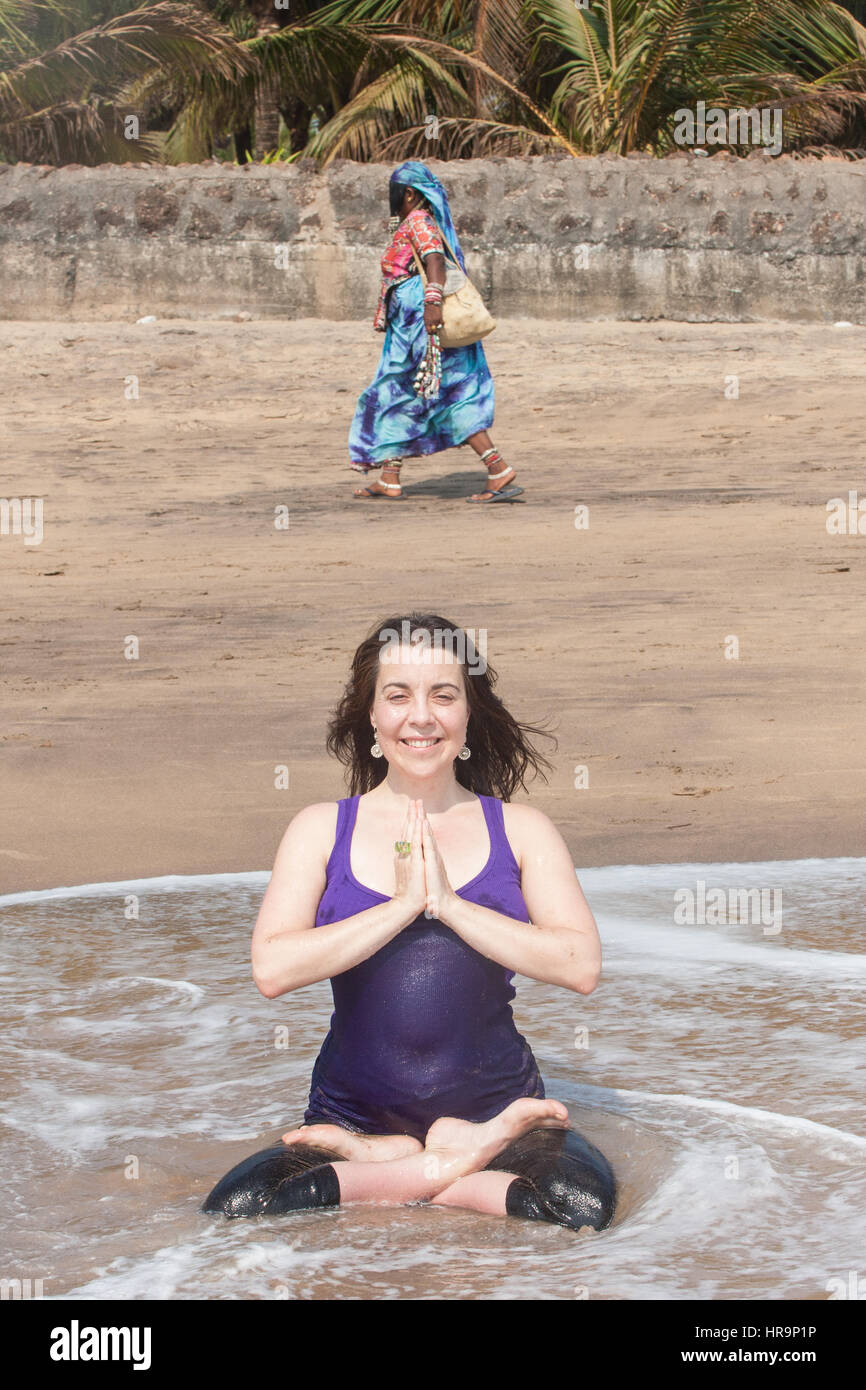 Premium Photo | Happy indian woman enjoying a vacation on the beach.