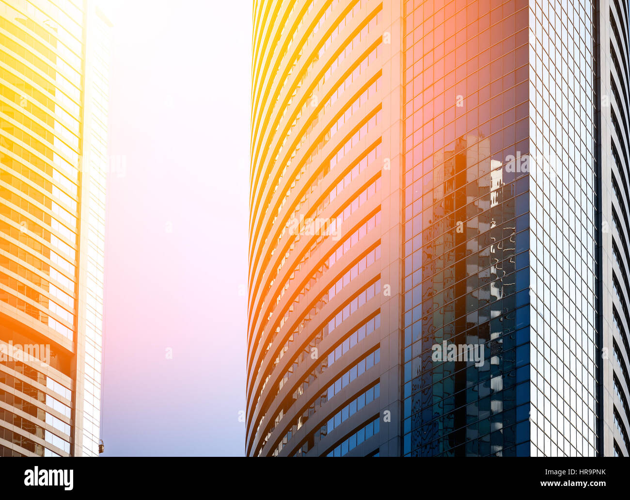 Modern office building close up in sunlight Stock Photo - Alamy