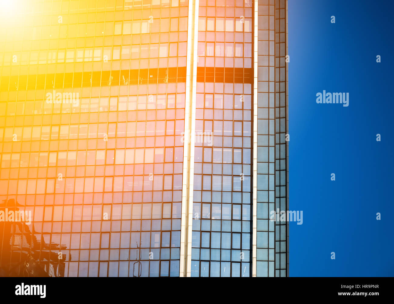Modern office building close up in sunlight Stock Photo - Alamy