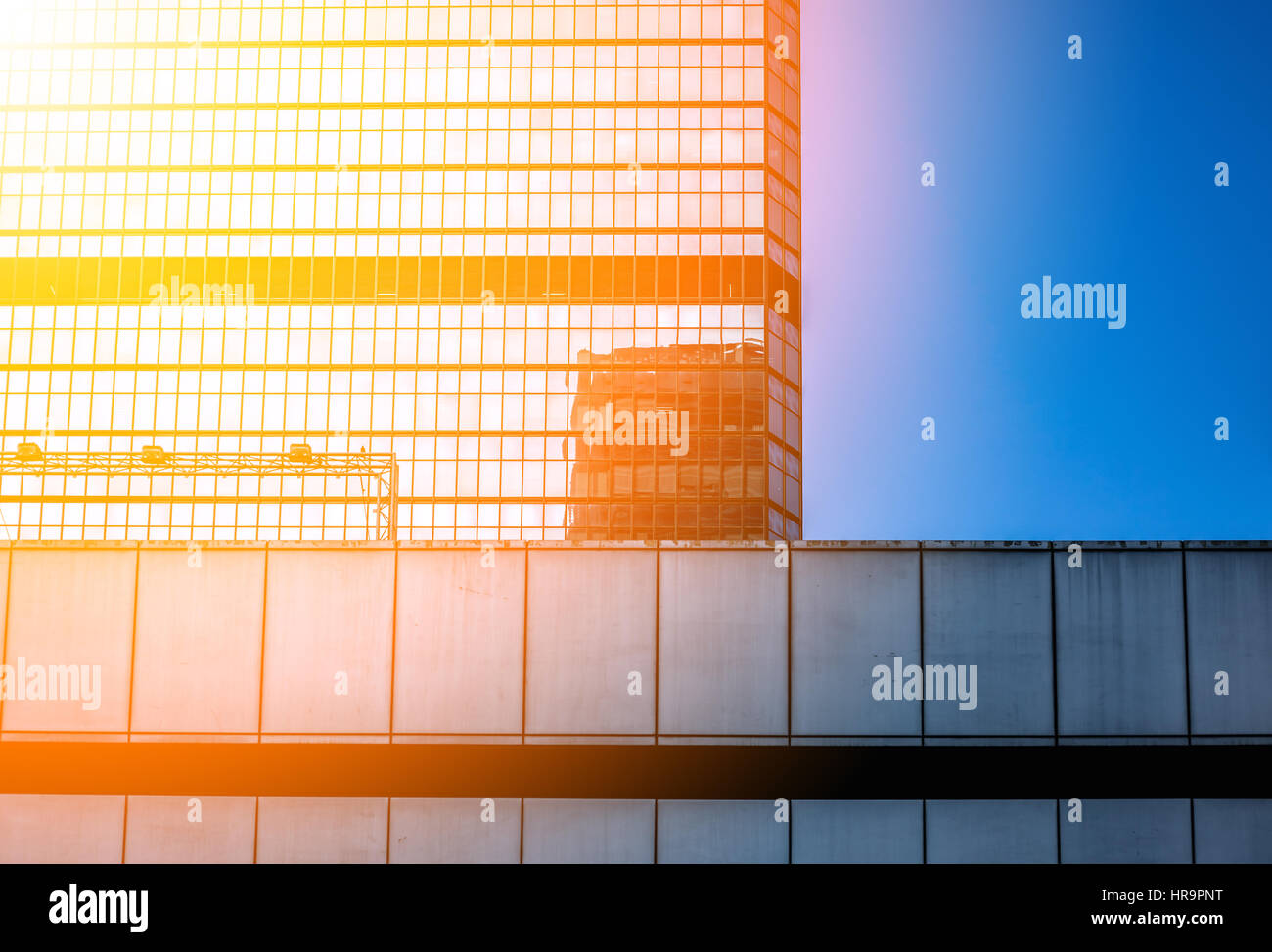 Modern office building close up in sunlight Stock Photo - Alamy