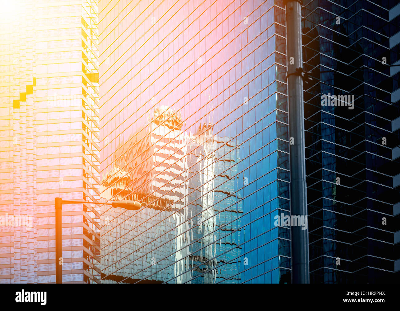 Modern office building close up in sunlight Stock Photo - Alamy