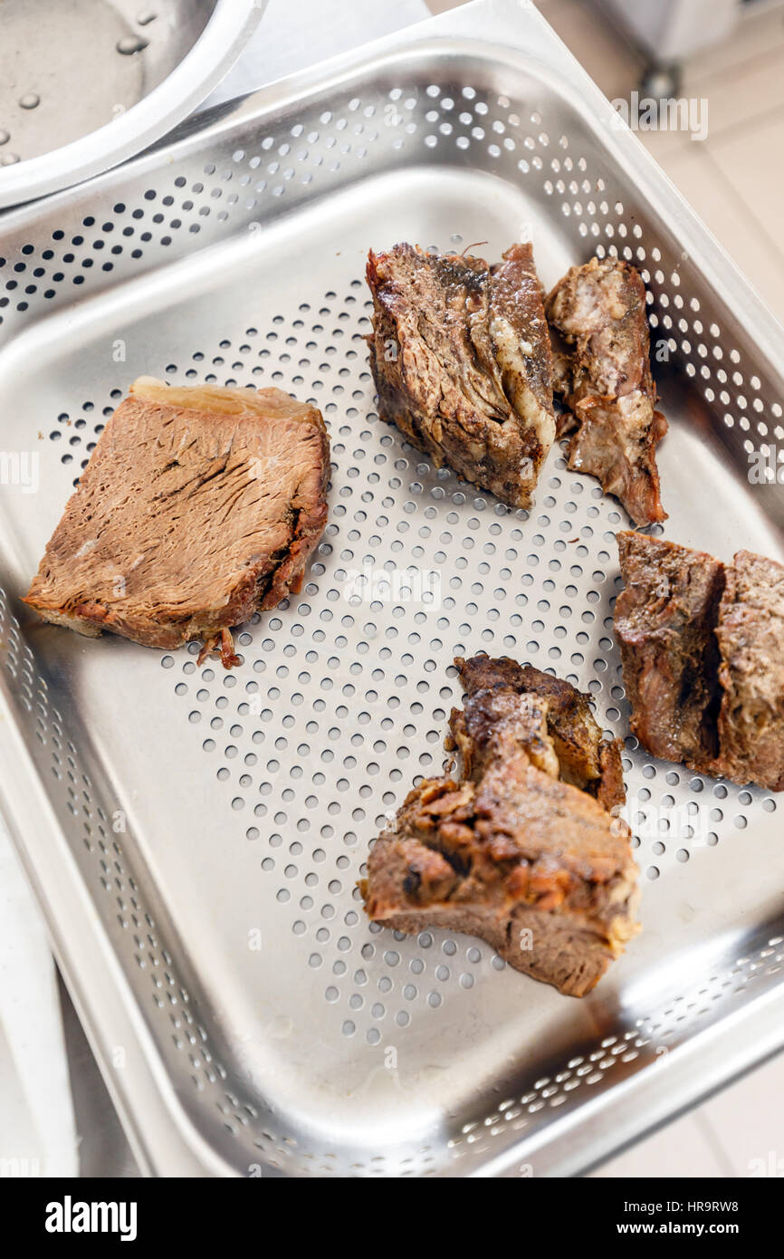 Beef meat on tray in hotel or restaurant kitchen Stock Photo