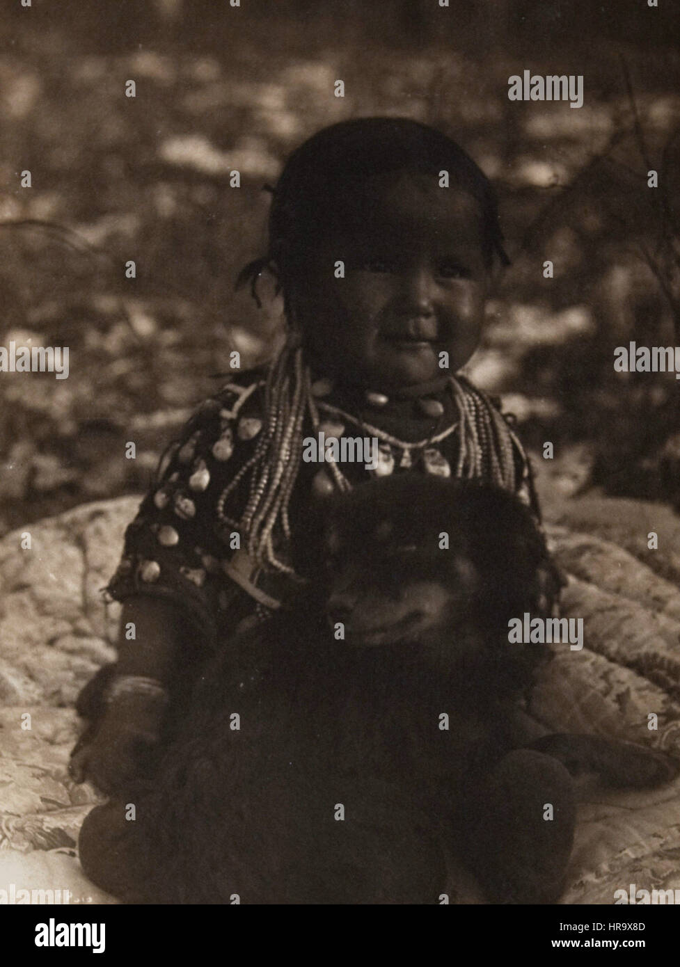 Native American child and dog Stock Photo