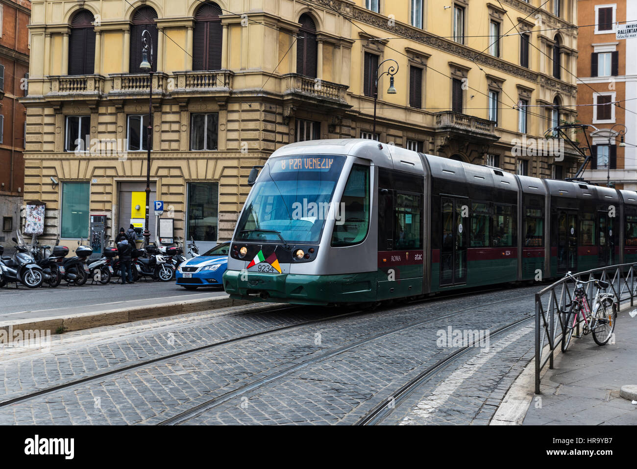 Rome, Italy January 2, 2017 Tram between traffic and a police car in