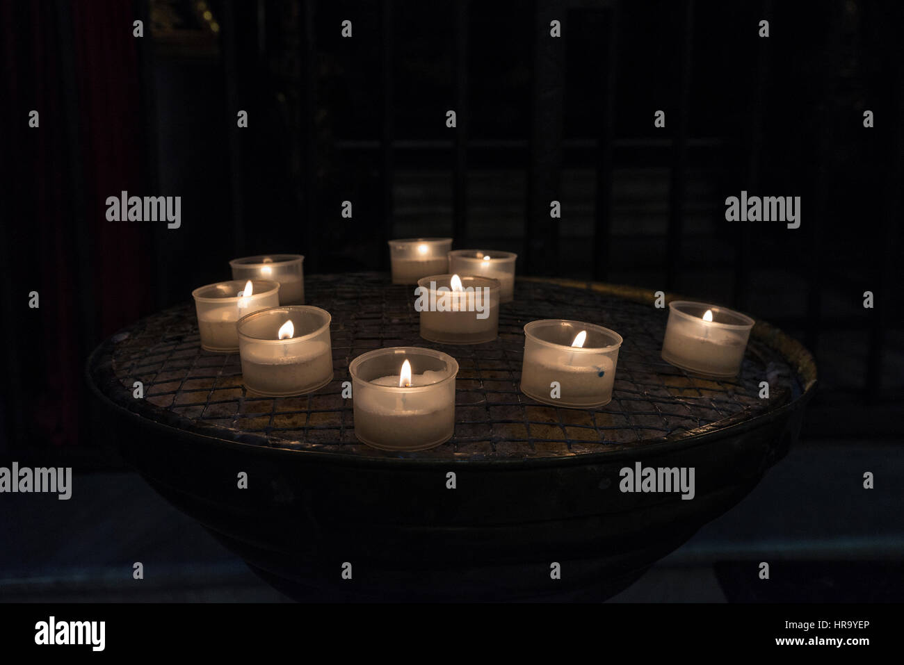 Candles in a church in the historical center of Rome, Italy Stock Photo