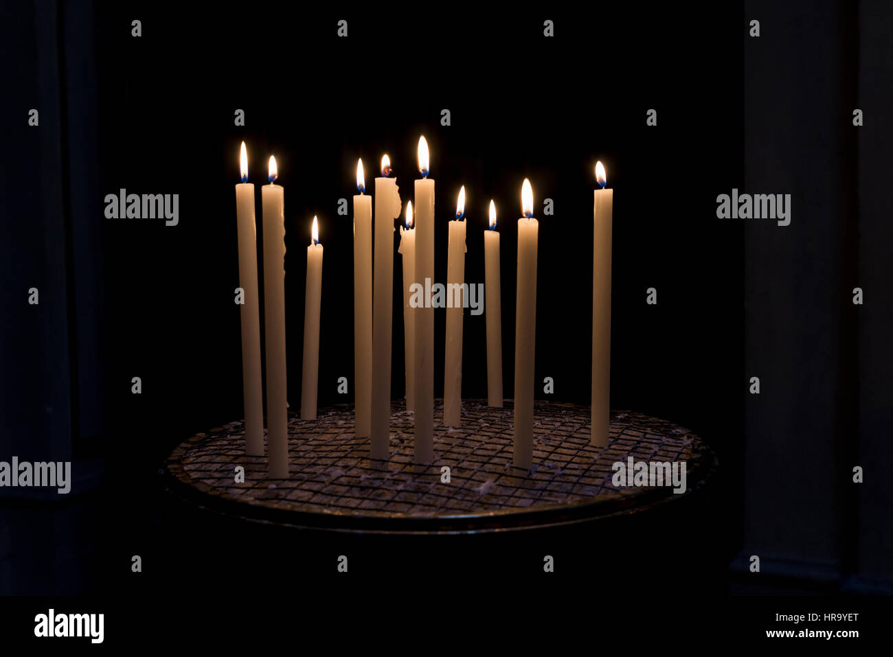 Candles in a church in the historical center of Rome, Italy Stock Photo