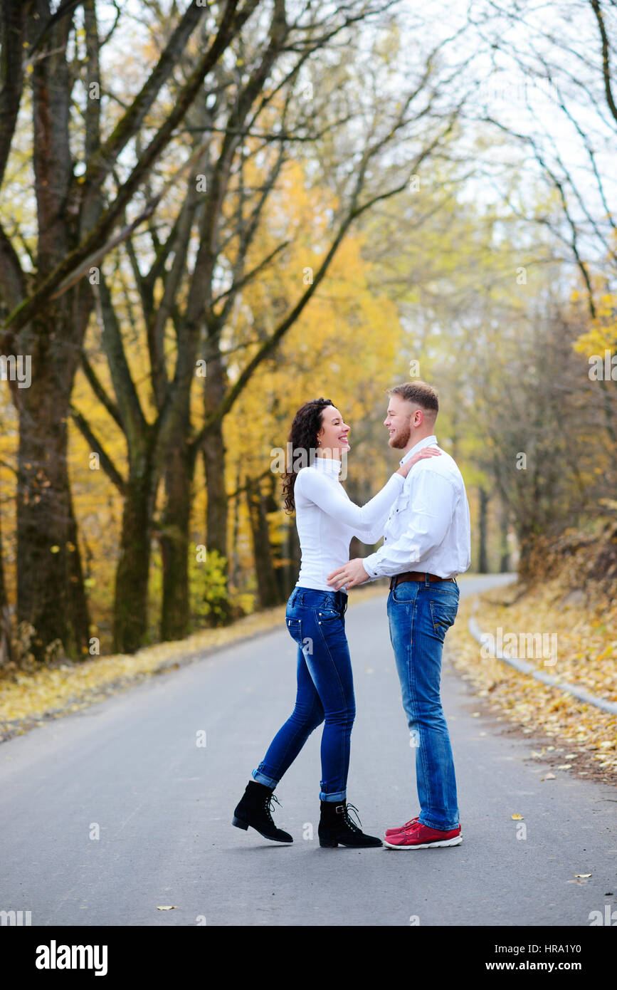 Portrait of young loving couple kissing in autumn park Stock Photo - Alamy