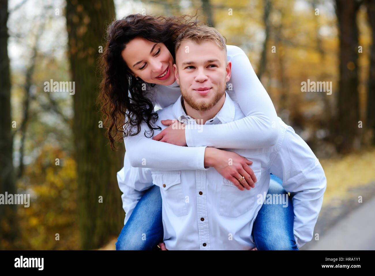 Lovers walking hand in hand in autumn park Stock Photo - Alamy