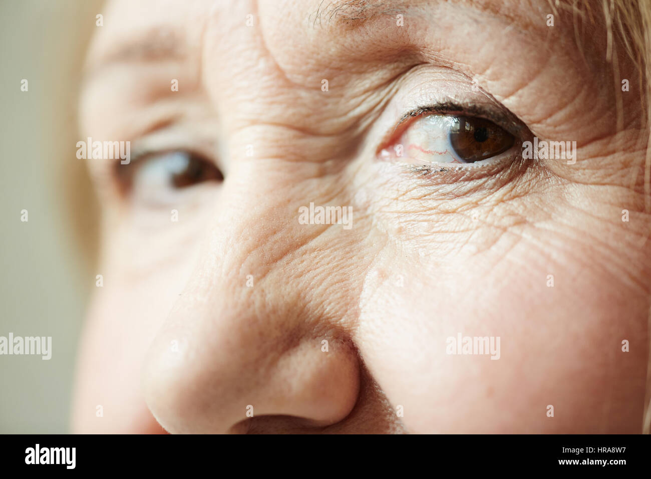 Extreme Close Up Shot Of Deep Dark Brown Eyes With Wrinkles Around