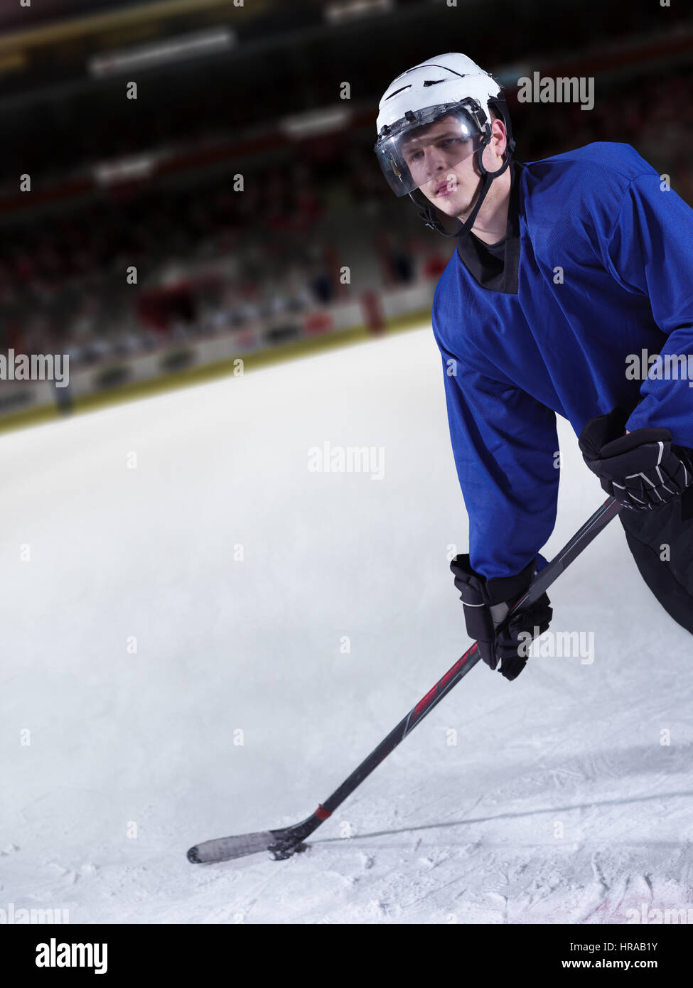 ice hockey player in action kicking with stick Stock Photo Alamy