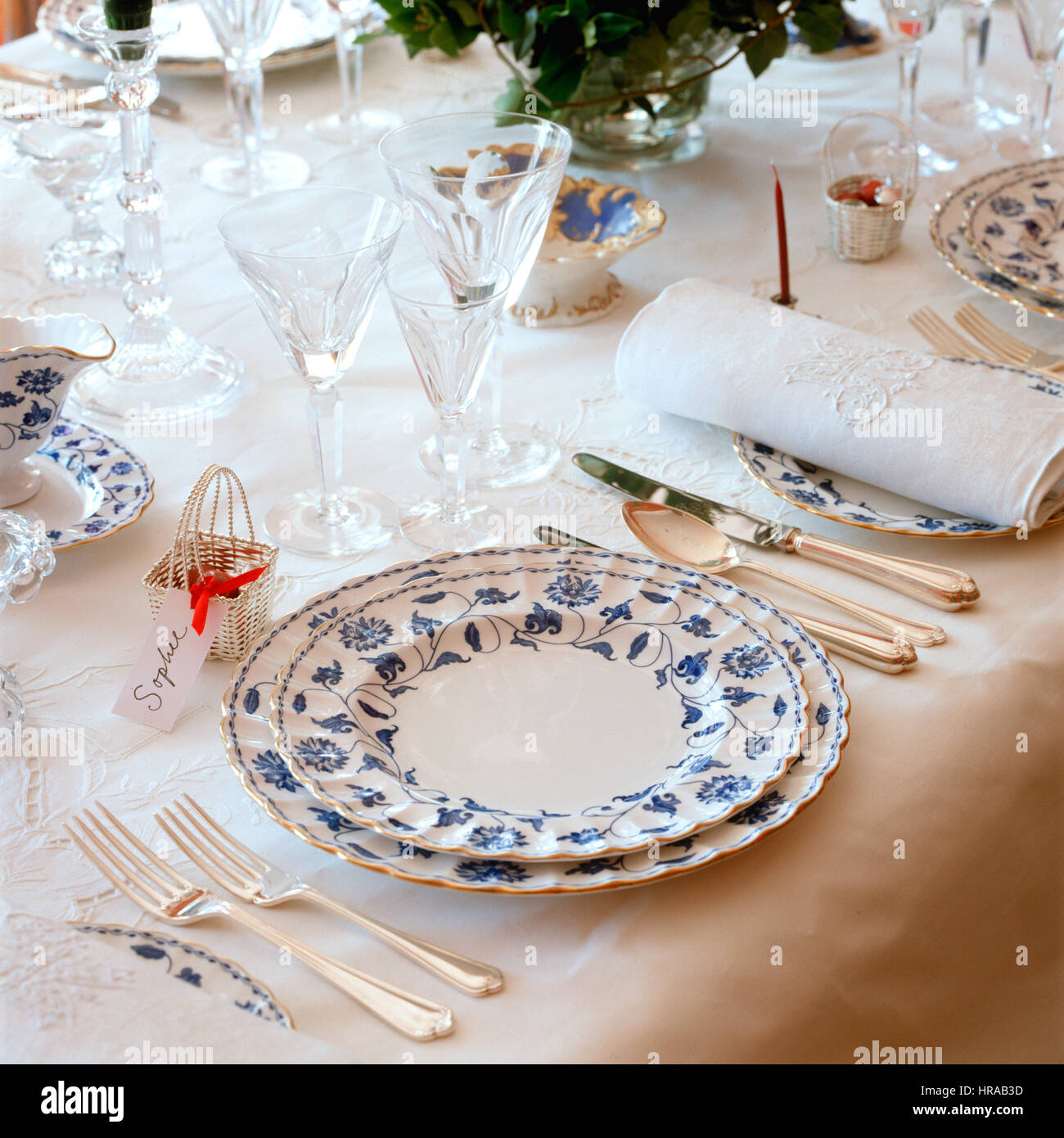 Embossed linen napkin on blue and white bone china plate Stock Photo