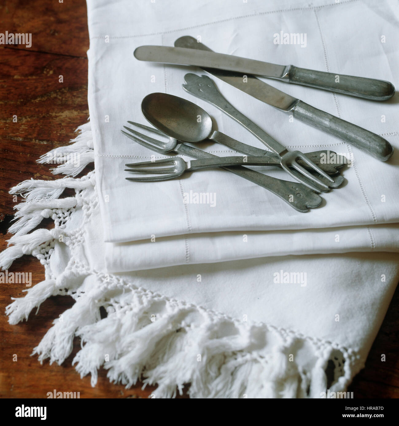 Napkins with sliver cutlery. Stock Photo