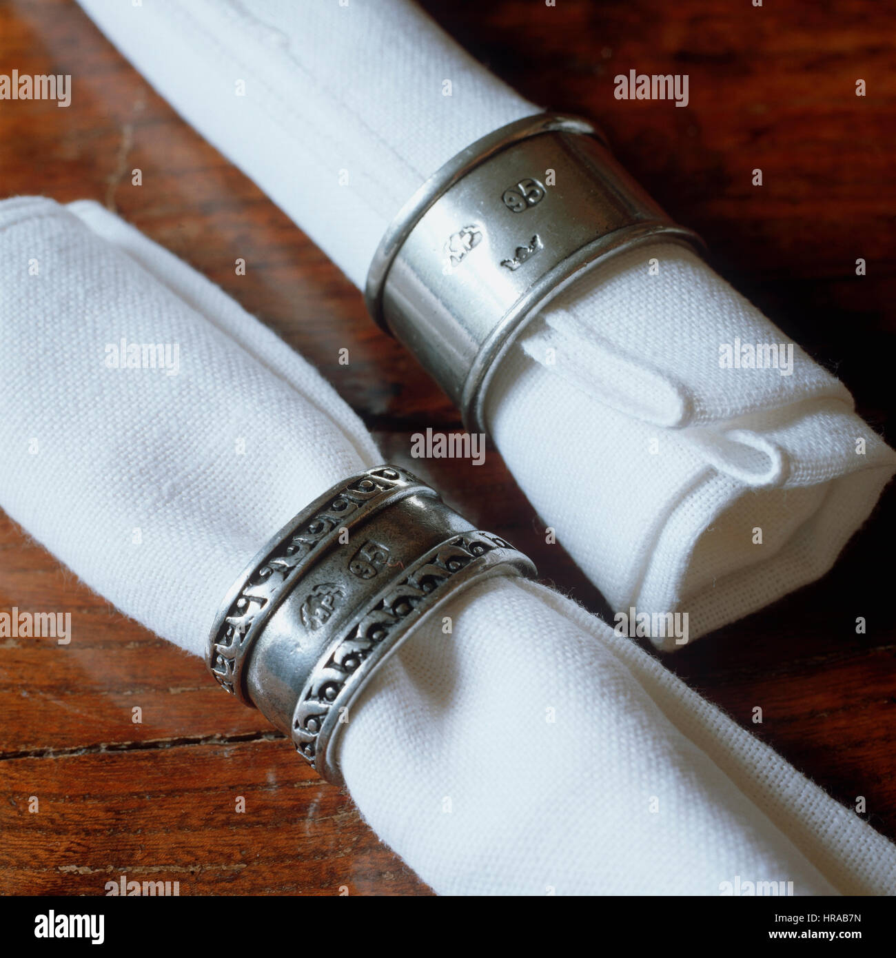 Napkins in silver napkin rings. Stock Photo