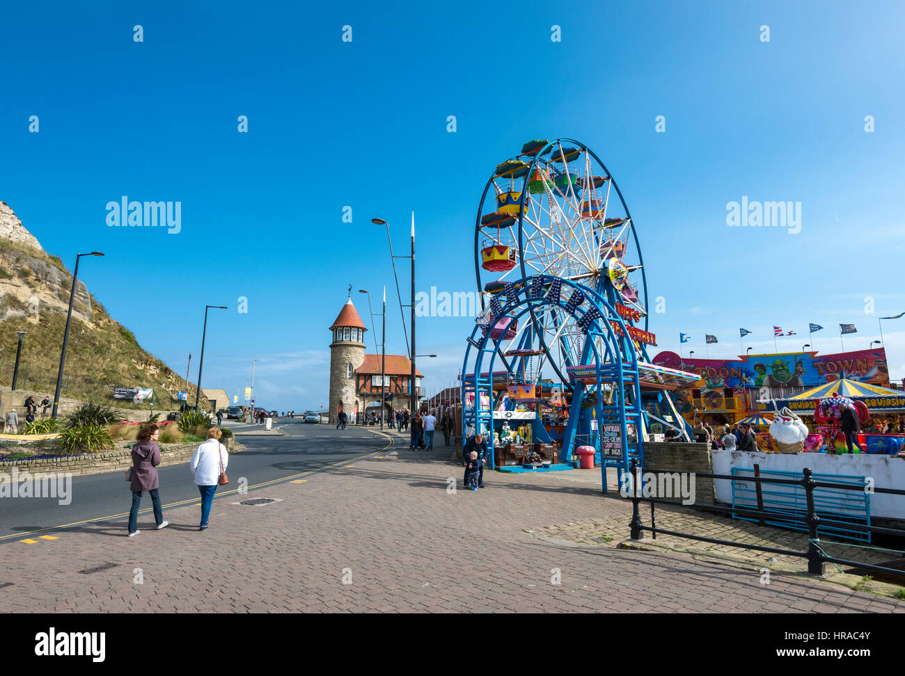 Small funfair beside the harbour at Scarborough, a seaside town on the coast of North Yorkshire, England. Stock Photo