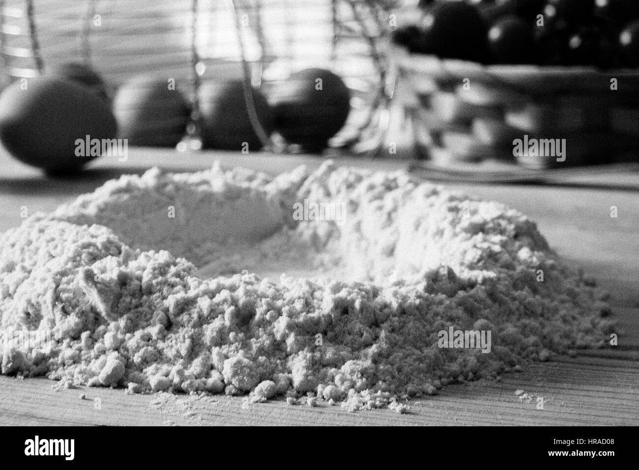Black and white image of Making pasta dough in an Italian kitchen showing flour and eggs Stock Photo