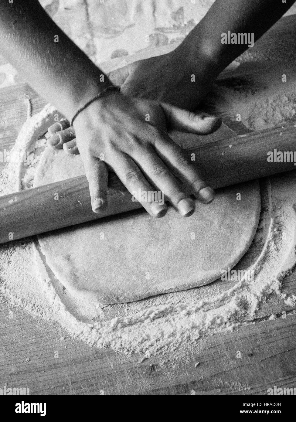 Picture of Rolling freshly made pasta dough in preparation prior to cutting Stock ...